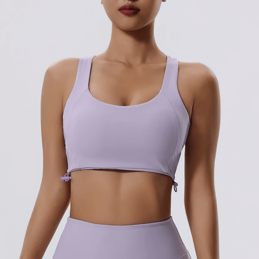 Purple adjustable sports bra with stylish push-up design, ideal for high-impact workouts and yoga. Breathable and fashionable fitness wear.